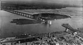[Aerial view of Jacques Cartier bridge construction over St. Lawrence River at Ile Ste.-Hélène, Montreal, Quebec.] [ca. 1929?]