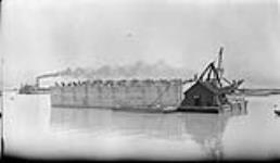 Concrete pier floating Welland Canal 7 July, 1916