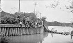 Boys fishing at Gerrard Street in the Don River 3 June. 1916