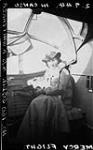 Nursing Sister A. Whittaker in Consolidated "Canso" A flying boat of No. 160 Squadron, R.C.A.F., during mercy flight 2 Sept. 1944