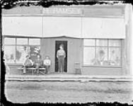 Mr. Harry Ramsay in doorway of his store, Lots 4 and 5, Block 2, Lauder, Man 1909-1913