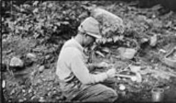 Preparing a fuse while making a road near Bala, [Ont.], 30 June, 1917 30 June 1917