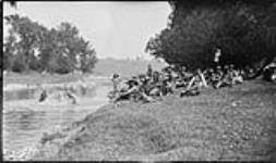 Flax pulling : girls bathing in Conestogo River at Camp Determination 25 July, 1918.