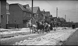 Snow scraper cleaning gutters, [Toronto, Ont.], 22 Dec. 1917 22 Dec. 1917