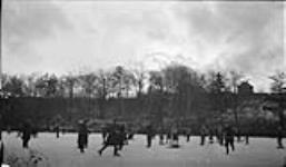 Hockey game at sunset in High Park 7 Jan. 1916