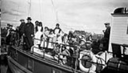 After the treaty dance.  Mission schooner GUY leaving; the children are bound for the convent at Fort Resolution 1937