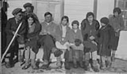 [Lafferty family of the Tlicho (formerly Dogrib) First Nation, Behchoko (formerly known as Rae-Edzo or Fort Rae), Northwest Territories, 1937.] Original Title: Lafferty and family 1937