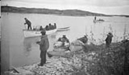 Dogrib Indians on their way to be paid Treaty at Fort Resolution camp at Outpost, N.W.T 1937