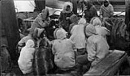 Inuit aboard H.M.C.S. Karluk at Pt. Barrow [Alaska], visiting, trading and having tea and hardtack, August 1913 1913 - 1914