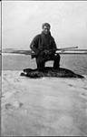 F.W. Maurer with the first seal shot at Rogers Harbor Wrangell Island, [Alaska], June 1914 1913 - 1914