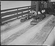 Children on toboggan slides Quebec, P.Q n.d.