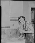 [A lady cleaning with] Swifts Cleanser 8 Feb., 1949