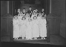 A group [at their] First Communion at Ecole Nouvelle, [Quebec, P.Q.], 23 April, 1949 29 Apr. 1949
