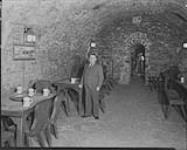 Mr. Demers in Boswell vaults at the Boswell Brewery, [Quebec, P.Q.] 21 July, 1932