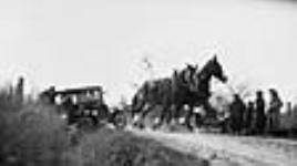 Automobile being pulled out of a ditch by a team on Erindale Avenue 29 Oct. 1922