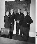 The Maritime Premiers pose in front of Confederation Bronze Plaque in the Confederation Chamber of the Provincial Building, Charlottetown, P.E.I. which was unveiled by Her Majesty Queen Elizabeth II, Sept. 1964