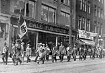 Italian-Canadian Reservists marching off to First World War. Yonge and Dundas Streets, Toronto, Ontario c 1915