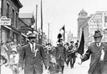 Italian Reservists Living in Toronto, going to war, marching down Yonge Street, just below Gerrard Street looking North ca. 1910-1920