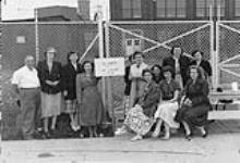 Strike - Place unknown. Picket captain Alfred Lachance agreed with the women strikers' determination to "stay out six months if necessary" to win the strike 1951