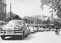Car cavalcade demanding that the St. Lawrence Seaway be built and controlled by Canada on Canadian Territory 1954