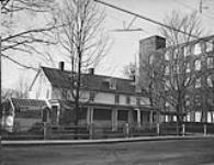 Home of Mr. Van Der Groot, American manager of Montreal Cottons, Valleyfield, P.Q. (Part of mill in background) May, 1952