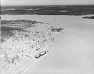 Aerial view of Gillies Brothers and Co. Ltd sawmill and depot buildings on Cassels Lake, 4 miles east of Temagami, Ont ca. 1947 -1957