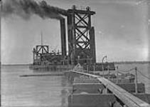 Dredge "Cyclone" west from pipe line, Sunnyside, Toronto, Ont June 22, 1916