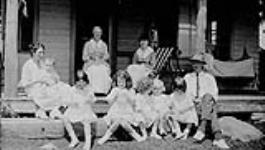 Mr. & Mrs. (née Marjorie Parkin) J.M. Macdonnell with Nurse Leo and children, also children of Mr. & Mrs. W.L. Grant (née Maude Parkin) July 1920