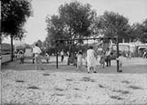 (Sunnyside) Teeter-totters & swings at Sunnyside, Toronto, Ont July 1, 1931