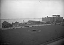 (Docks) View south of Toronto Harbour Commission Administration Building showing Canada Steamship Lines, Ferry docks & Terminal Warehouse May 8, 1944