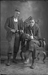 [Unidentified men drinking beer in Renaud's studio, Sainte-Agathe, P.Q., 1920-1932.]