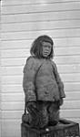 Native boy. [Akumalik, the son of Ululijarnaaq. This photo was taken near R.C.M.P. Detachment.] Aug. 1923