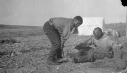[Inuuk men named Keegapoo and Ooga making fire] Original title: Natives "Keegapoo" and "Ooga" making fire 1925