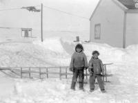 Ivelingment [Aivilingmiut] boys, Burwash's sled near Hudson's Bay Co's House, Repulse Bay, N.W.T., May 1926 1926.