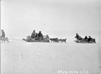 [Inuit leaving Gjoa Haven on dog sleds] Original title: Native sleds leaving Gjoa Haven 12 May 1929.