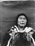 Native of Baffin Island. [Inuguk Panikpak wearing a women's caribou parka used for photographs. She was the mother of Qajaaq.] August 1931.