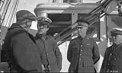 Mr. Mackenzie, Commander Macdonald, Inspector Wilcox and Captain Joseph-Elzéar Bernier, aboard C.G.S. ARCTIC 1925