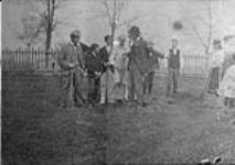 Arbor-day at Upper Canada College, 1898. (George Parkin with arm outstretched) 1898