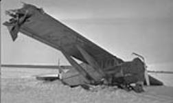 Wreck of Commercial Cuswaye plane on which R.T. Porsild travelled from Edmonton bound for Aklavik 1930