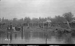 Buffalo Lake - Indian Camp and fish stages at the outlet of Buffalo Lake, [N.W.T.] 1938.