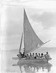 [Inuit in a sailboat in Lona Bay] Original title: Boat load of natives in Lona Bay 16 August 1928.