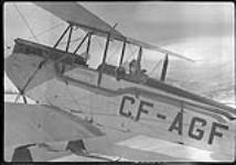 [G.H. Finland in a de Havilland 'Gypsy Moth' aircraft CF-AGF at Cominco Air School, Creston, B.C., c. 1930.] [ca. 1930]