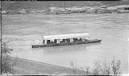 Ferry boat crossing Yukon at Dawson 1920