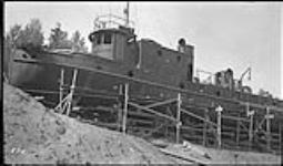 N.T. Co.'s "Radium King" steel boat being assembled at Fort Smith, Sections shipped from Montreal 1937
