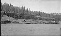 N.T. Co. "Radium King" being assembled at Fort Smith. Large wood barge also being constructed 1937