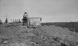 Giant Yellowknife Gold Mines Ltd., headframe and dump at No. 4 shaft 1940