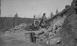 Ptarmigan Mines road construction equipment in operation 1944
