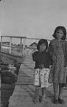 Two [Indigenous] children [left - Caroline Douglas, right - Rosa Washie nee Young], Rae, N.W.T Sept. 1946