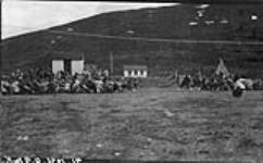 [Inuit women playing tug-of-war at a Woman's Auxiliary picnic] Original title: Tug-of-war native women. Women's Auxiliary picnic 1936