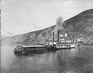 Steamer "Susie" & barge in the Yukon, c. 1905 ca. 1905.